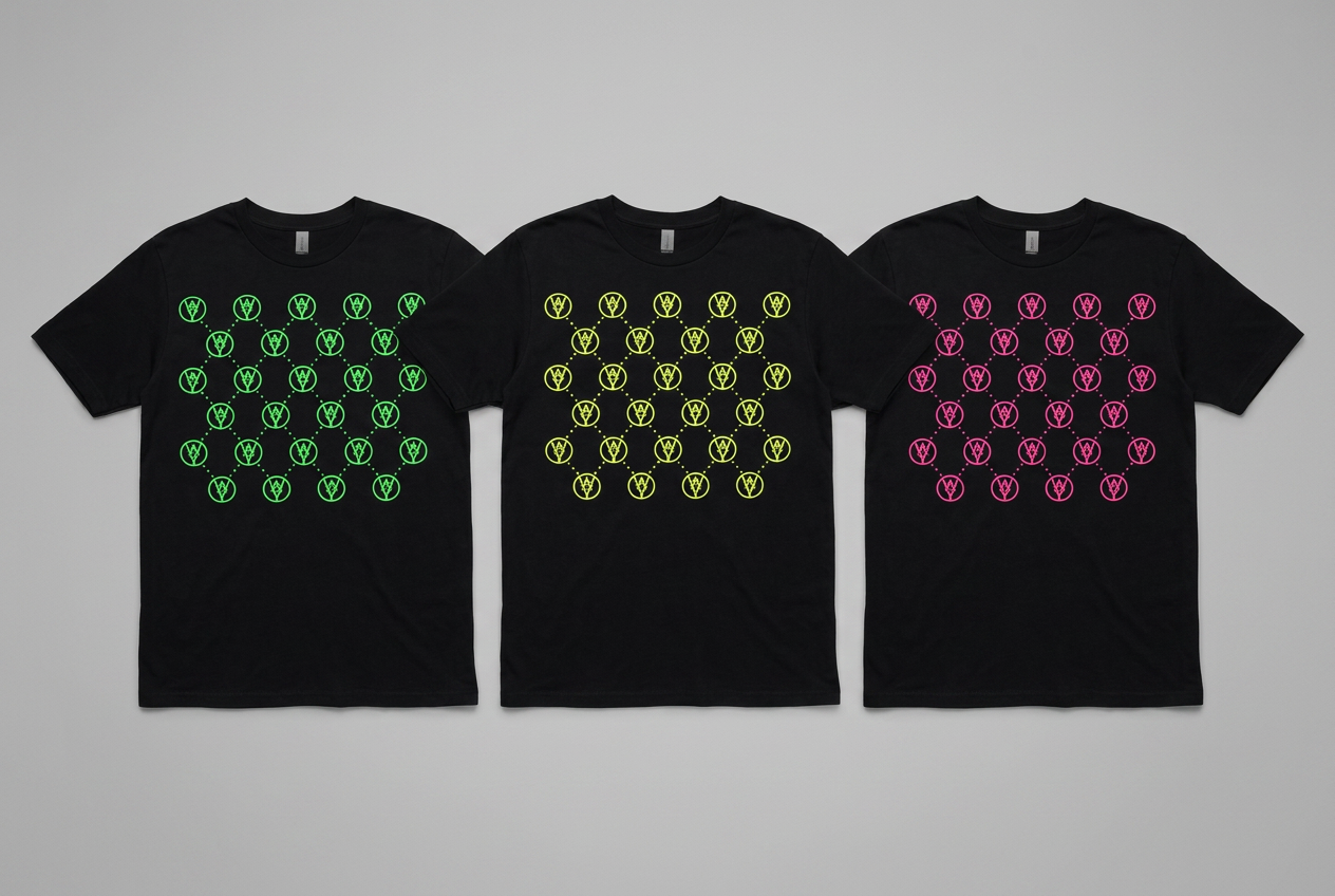 Three black t-shirts featuring neon green, yellow, and pink repeating printed patterns.